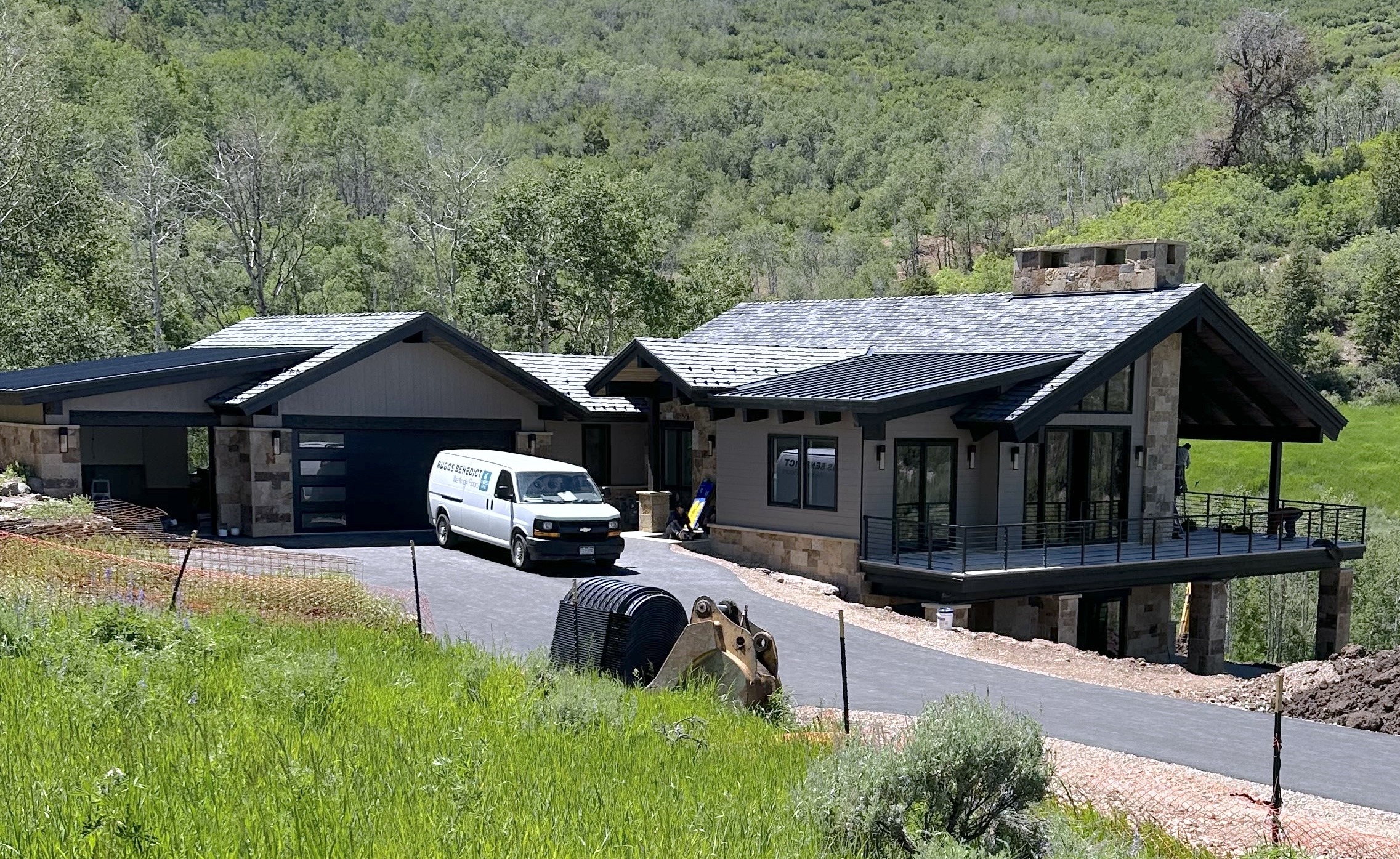 Framing stage of a custom luxury home under construction in the mountains of Avon, Colorado by H&C Construction