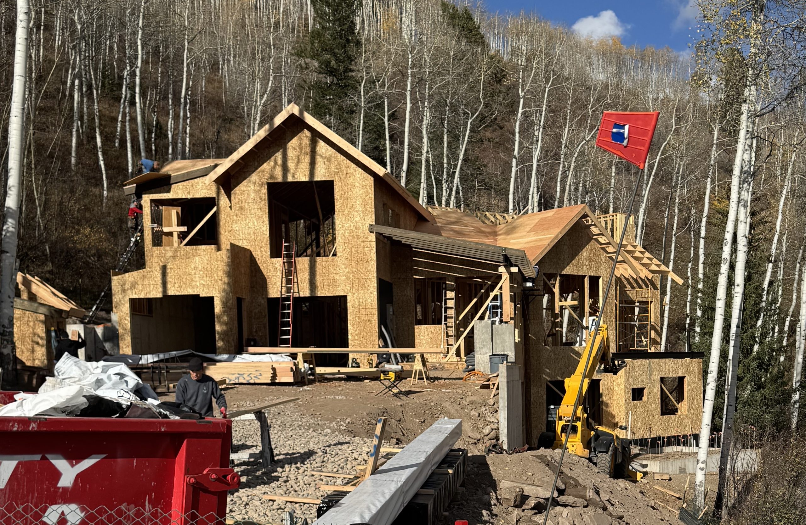 Framing stage of a custom luxury home under construction in the mountains of Avon, Colorado by H&C Construction