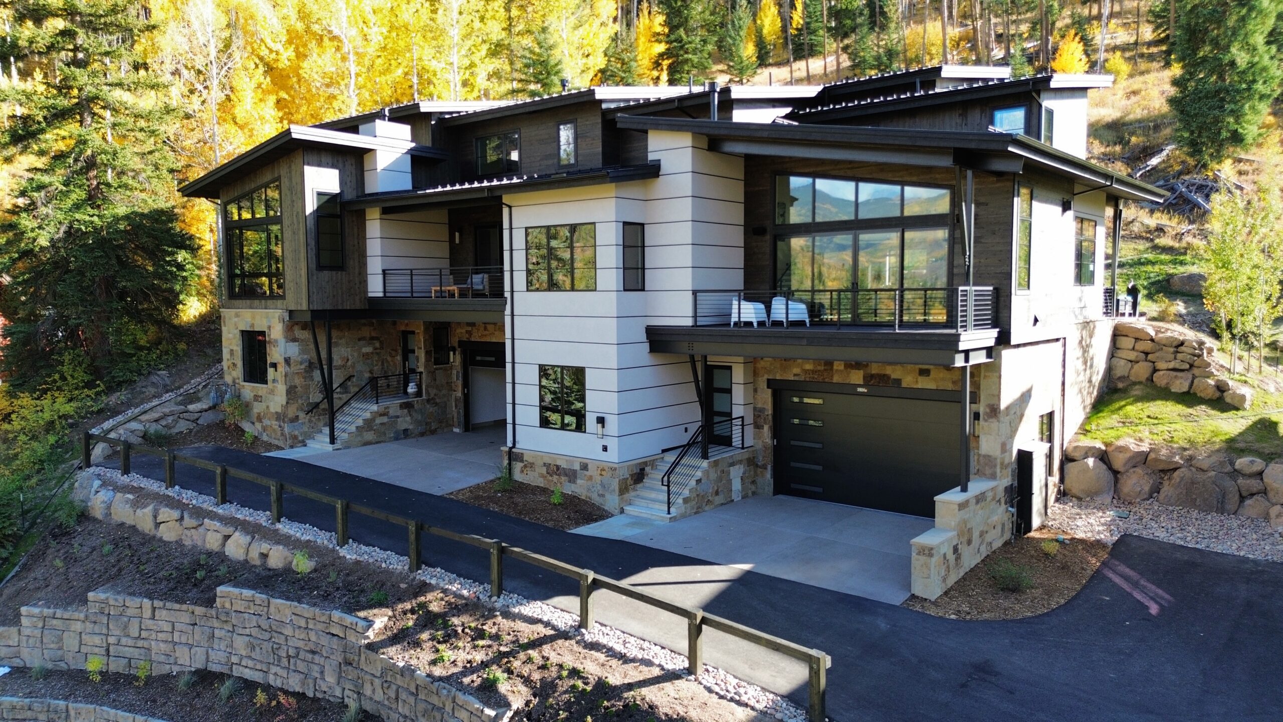 Framing stage of a custom luxury home under construction in the mountains of Avon, Colorado by H&C Construction